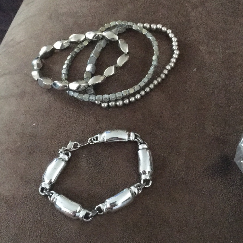 Lot of 4 silver bracelets.